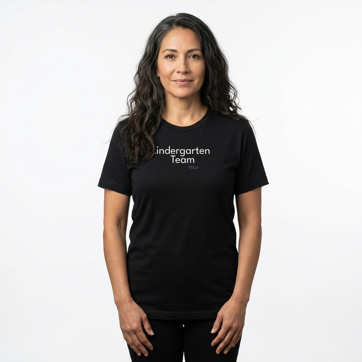 Talia wearing the Kindergarten Team T-shirt from TtCo with the design centered on the front.