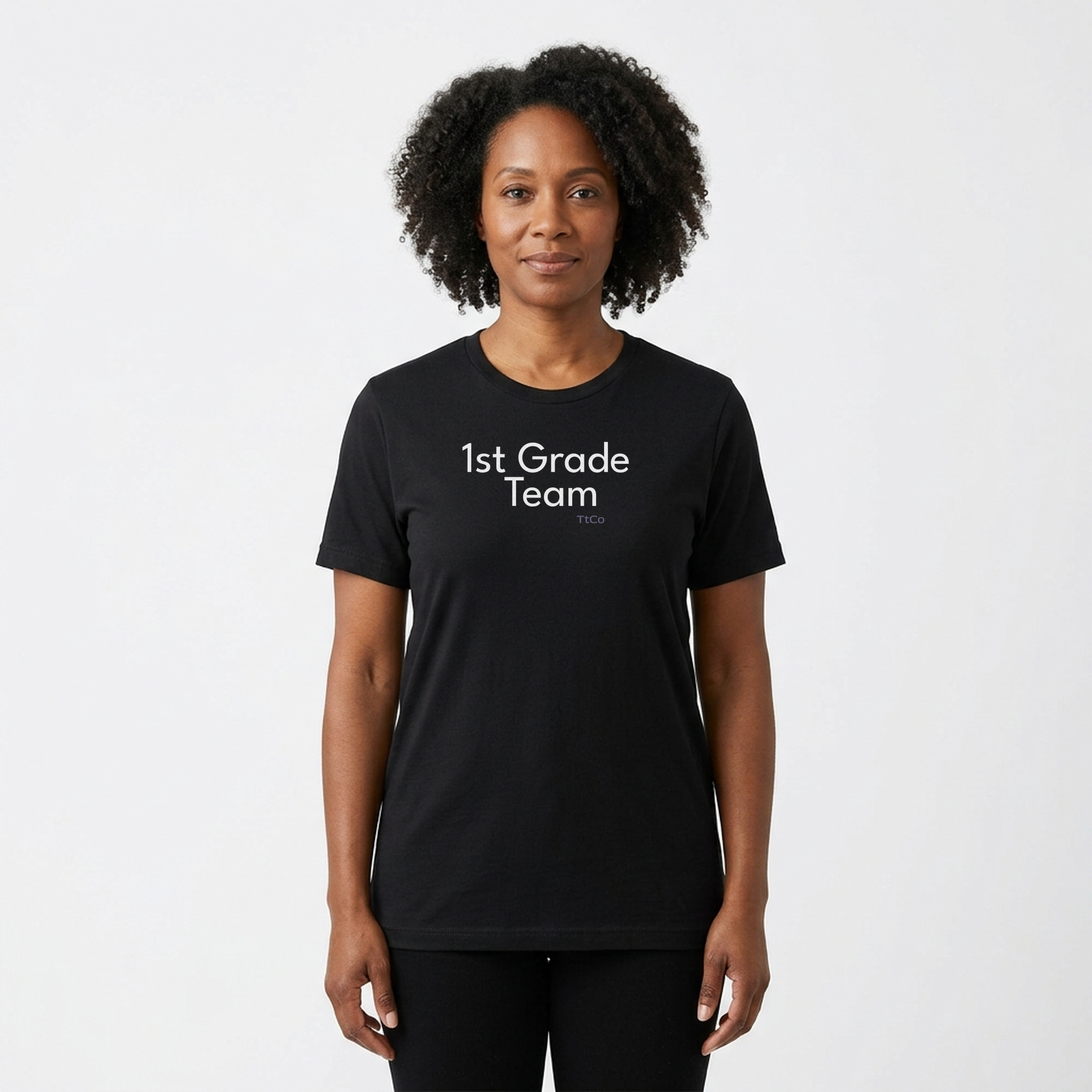 Amara wearing the 1st Grade Team T-shirt from TtCo with the design centered on the front.