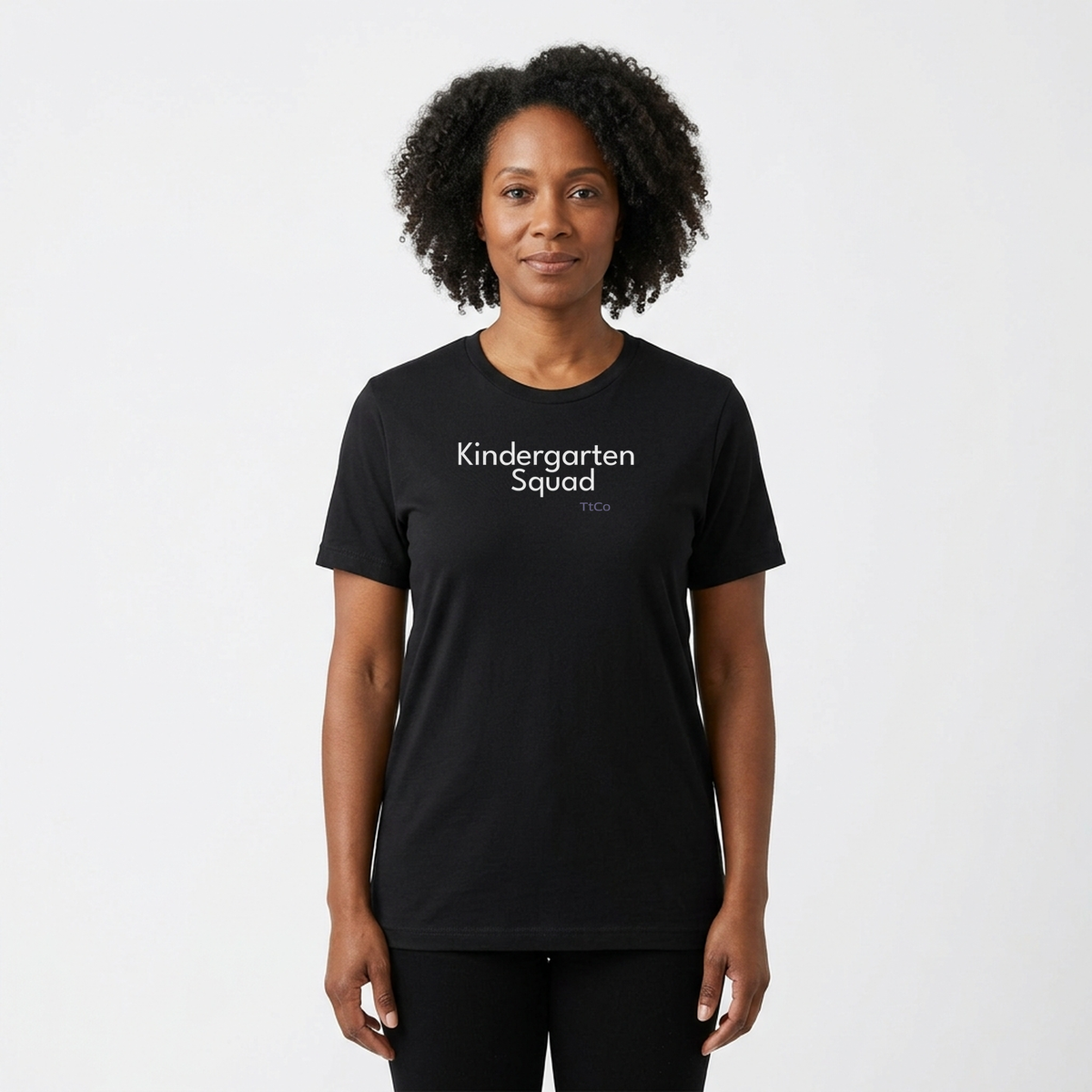 Amara wearing the Kindergarten Squad T-shirt from TtCo with the design centered on the front.