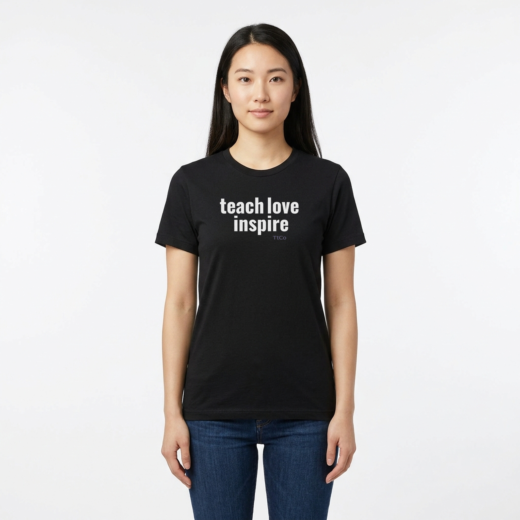 Hana wearing the Teach Love Inspire T-shirt from TtCo with the design centered on the front.