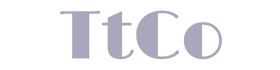 Tired teacher Co logo is displayed in silver print capital t, lowercase t, company abbreviated to Co, all one word TtCo, 4 letters on a transparent background.